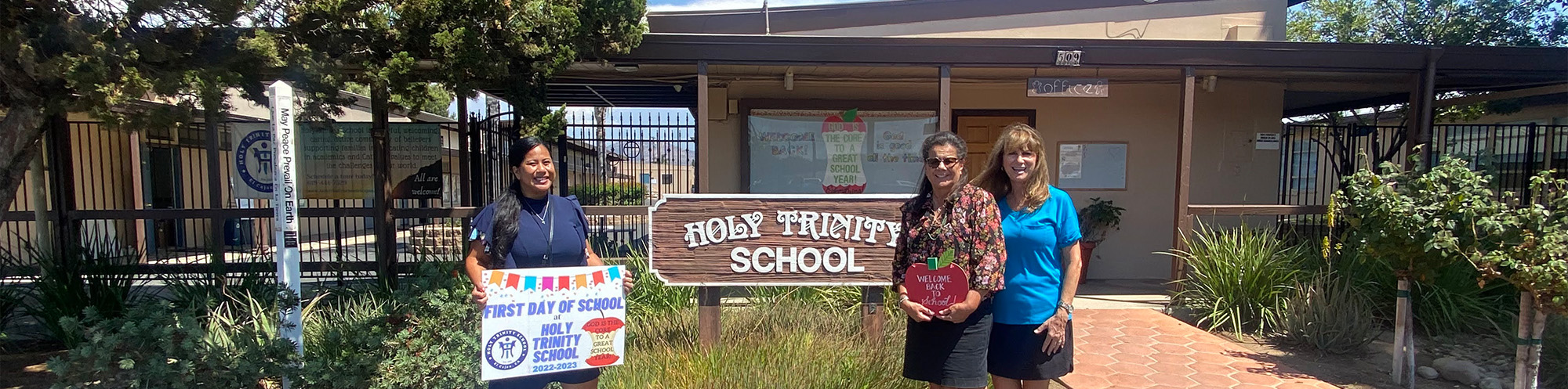 Staff in front of school on first day