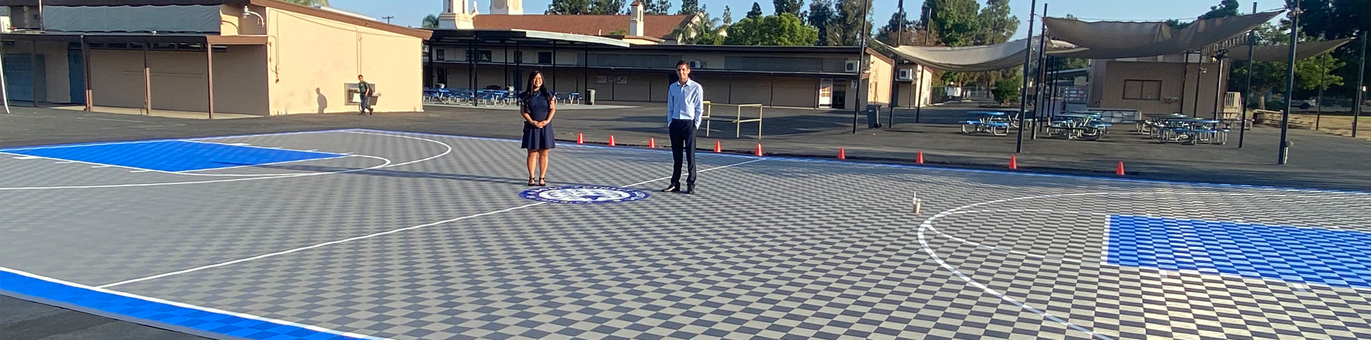 two students on outdoor basketball court