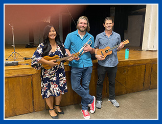 staff holding musical instruments